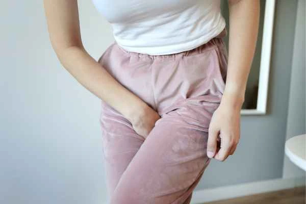 woman struggling with urine incontinence Brighton