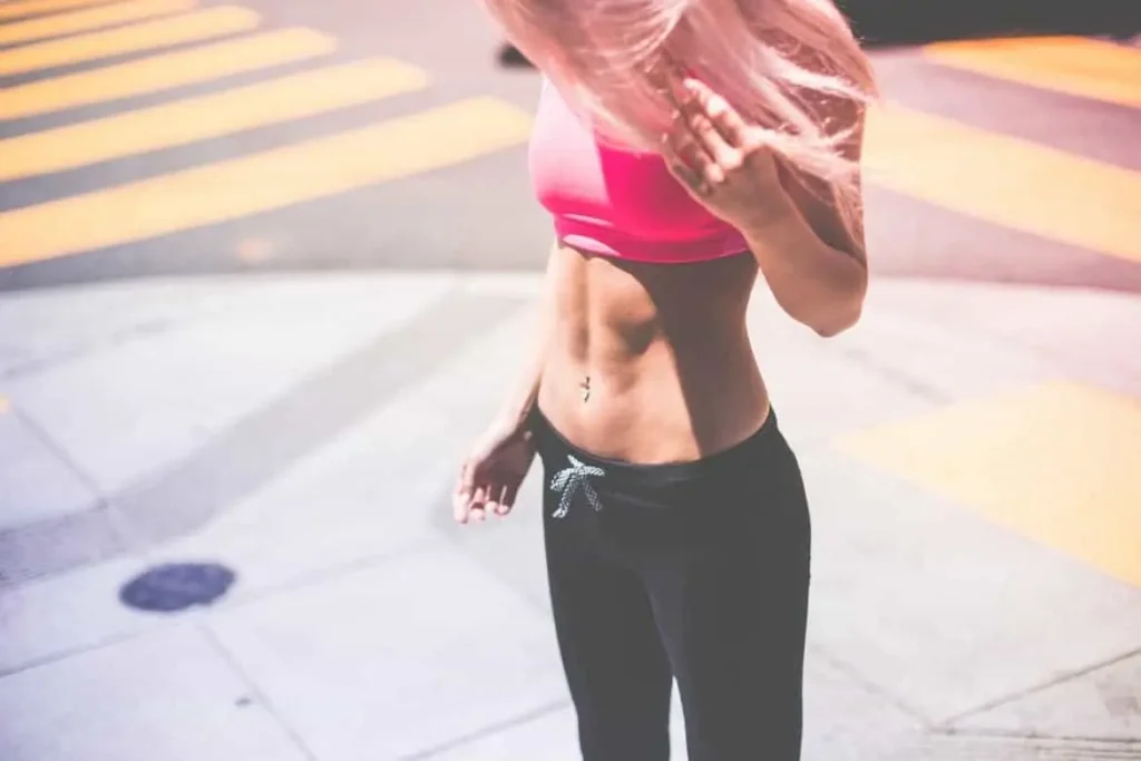 Woman with toned stomach after LA-EMS Body Sculpting Treatment Brighton 